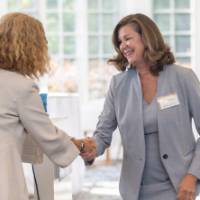 Janet Winter shaking hands